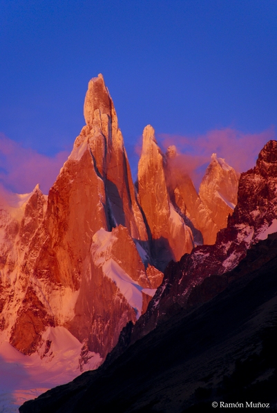 Sunrise over Cerro Torre, 3,102 m., Patagonian Andes. Without the sun of sunrise, only with the clarity of dawn the mountains are tinged with an intense red.
