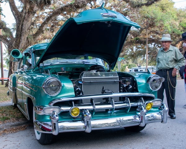 This is a 1954 Chevrolet Bel-Air modified as a Low Rider. Note the 1954 air conditioner on the left side of the photo.