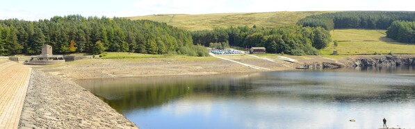 A panorama taken looking across the Errwood Reservoir dam during the drought of 2018.