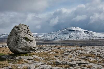 An erratic with spring snow covered Ingleborough