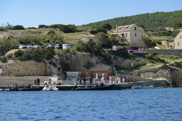 Pier with ticket office and boats at Biševo island