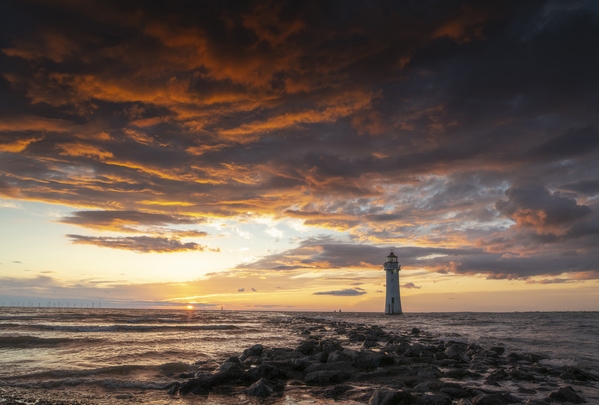 Sunset at Perch Rock lighthouse which is situated off the Wirral Penunsula