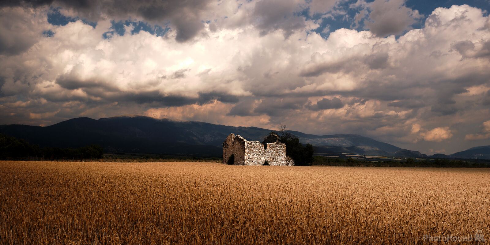 Image of Stone House in the field by Roman Martin