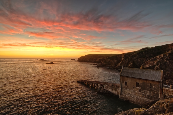 Lizard lifeboat station makes for a great subject with its slipway forming a strong leading line into an image.  This image was taken during Autumn when the sun sets over the south coast of Cornwall.