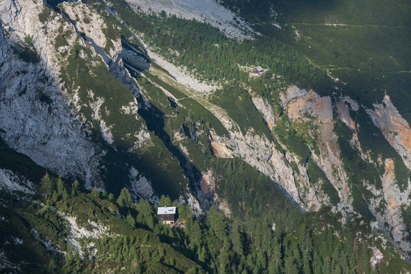 Two montain huts, Češka koča is at the back, the closer one is on the trail, the Kranjska koča