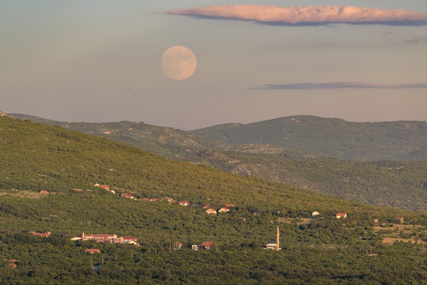 Full moon rising above Podvelež