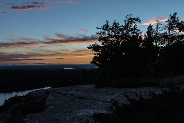 Looking west from the Bluff after sunset. In early August the sun is setting north of west at this latitude.
