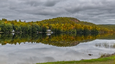This is a shot of the Parks Pond Bluff from the Parks Pond. The Bluff photo spots are on top of the bare rock ledges on the right side of the Bluff. This is late September and the foliage is starting to 