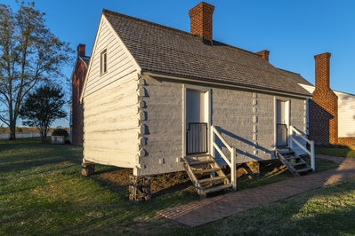 Slave quarters behind the McLean house. This is a 1965 reconstruction of the original 1848 slave quarters. The people who lived at this location were enslaved to the McLean family.