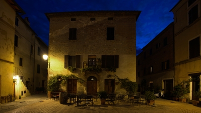 predawn shot of Osteria Sette di Vino in - Piazza de Spagna Charming little square in Pienza. behind me life was starting to wake in this hill top town, the coffee shop was starting to open up, the cleaners sweeping the Piazza in front of the cathedral RF24-105 F4L IS USMf8 4.0s ISO100, 