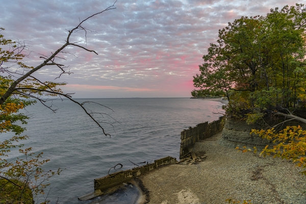 View of cove and seawall at sunrise
