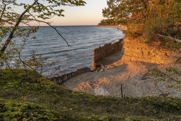 View of cove and seawall at sunset