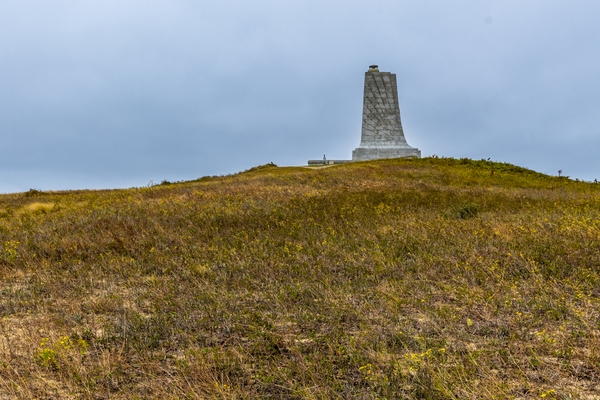 Monument from path climbing Big Kill Devil Hill.