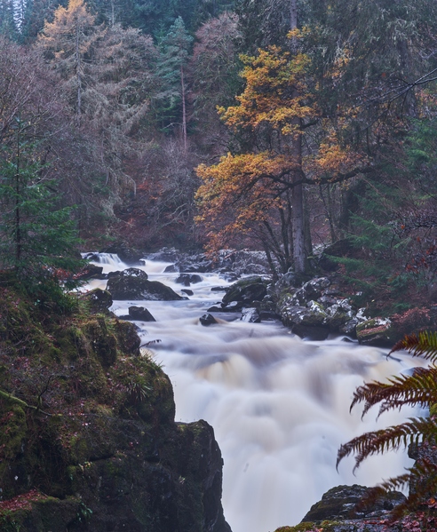 The river Braan falls by Ossian's Hall. This image taken from a footbridge accessible from the footpath.