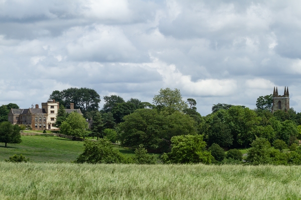 Taken from the road to Eydon and looking back over the House and the Church. Hidden by the bank of trees are the old fishing ponds, now owned by a private club and not open to the public. 
