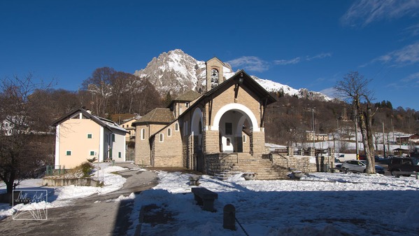 Chiesa del Sacro Cuore with the peak of Grigna Meridionale in the background