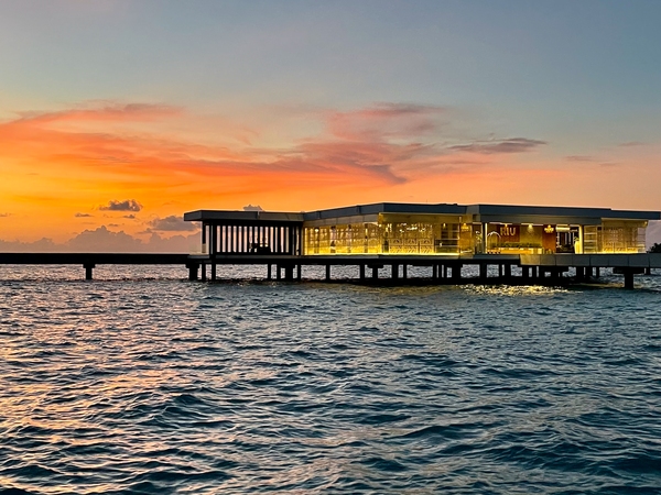 Hotel Dhaalu Maldives, reception at sunset from a boat