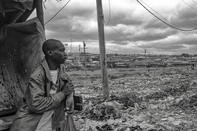 This was a pretty random shot, with quick focus, and was one of my favorites from this shoot. Nothing is posed here, this is as it was shot and there is a look that says it all here, this is his world daily in Kibera.