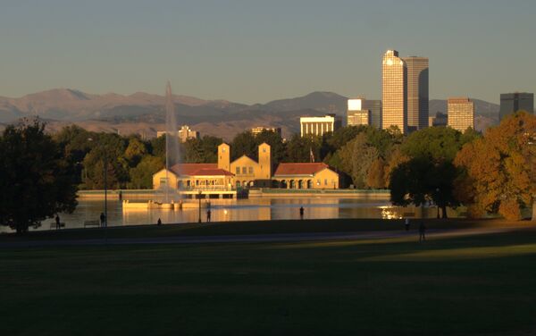 Denver City Park Pavilion on Ferril Lake with Denver Skyline and Rocky Mountain Front Range at sunrise. Taken from the West Patio.Sony Alpha58 kit lens 55 mm f/7.1 1/250 second ISO-100