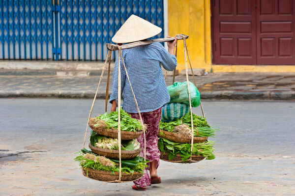 Local Street Vendor and Quang Ganh (bamboo shoulder pole)