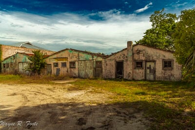 Abandoned buildings along the waterfront.