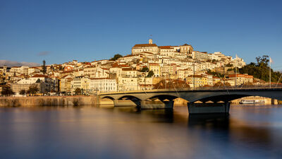Golden hour view of Coimbra on Mondego River