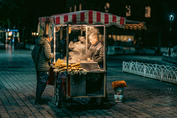Visiting in the evening sees fewer people- the corn and nut sellers make for a good subject