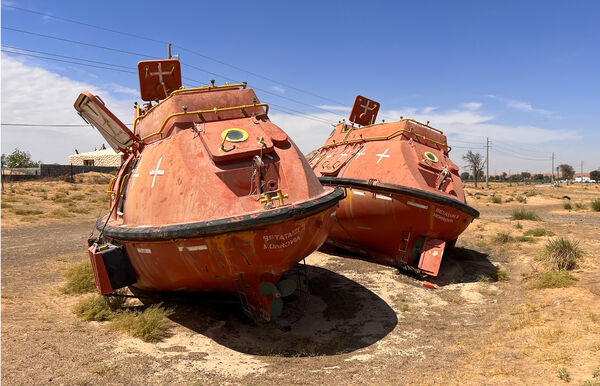 The two randomly placed old lifeboats on the outskirts of Maleha, Sharjah.