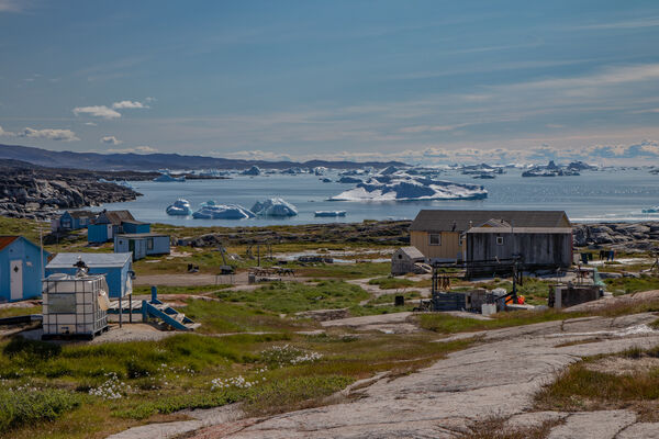 Houses and icebergs in Oqaatsut - just an amazing view to have on your doorstep!