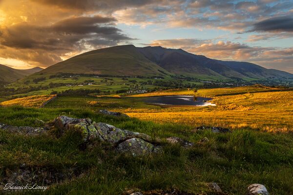 Tewet Tarn at sunset with Blencathra behind.