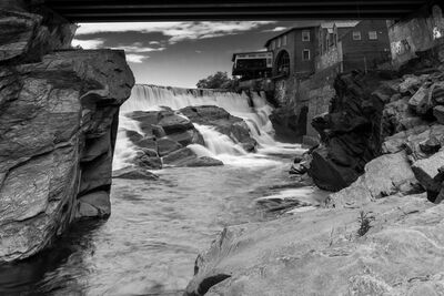 BW image of the falls above the bridge from the rocks downstream from the bridge. Shot with 10-stop ND filter and 3-stop soft GND filter for the sky.