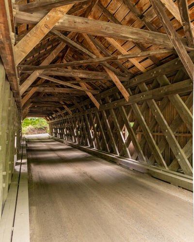 Bridge interior - the crossed beams along the side are part of the lattice truss support system.