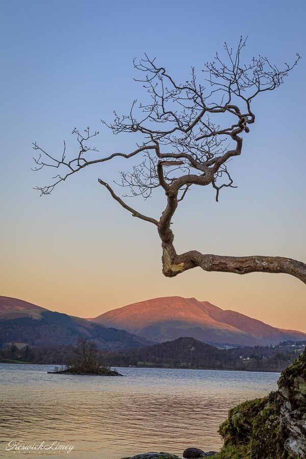 Looking out over Derwent Water to Blencathra from Otterbield Bay at sunset.