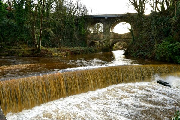 At the confluence of the rivers Goyt and Sett, the weir was in full flow after heavy rain.