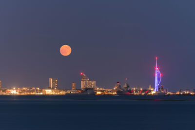 July full ‘Buck’ moon over Portsmouth skyline.
