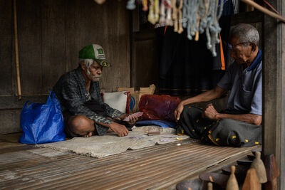 Bena Traditional Village - men playing cards