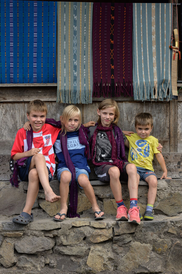 Bena traditional village - visiting boys with scarlet scarfs.