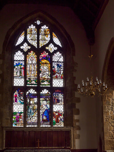St Peter and St Paul Church, Chipping Warden. The main stained glass window by Christopher Whall, part of the Arts & Crafts movement