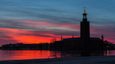 Red vivid sunset behind City Hall of Stockholm