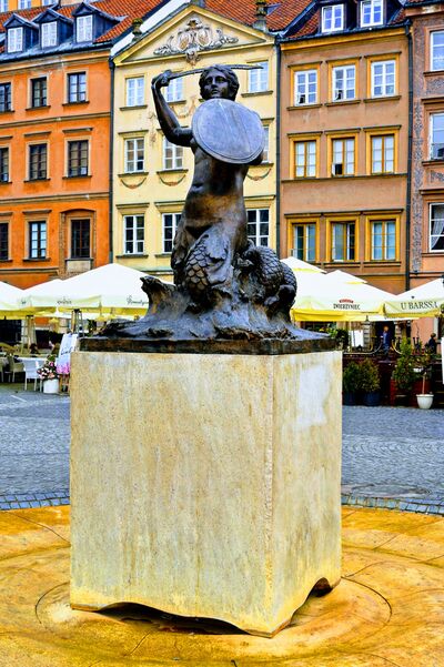 Warsaw's best loved monument - Syrenka. Cast in 1855 this mermaid's form graces every bus, tram and coat of arms you'll find in the capital.  A bronze sculpture by Konstanty Hegel, it has stood as the symbol of Warsaw since 1855.