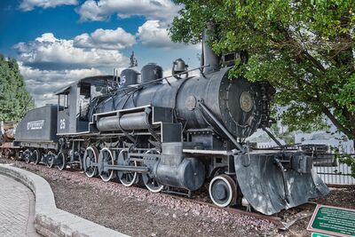 This old Baldwin Locomotive once served the local lumber industry, hauling huge tree trunks from the forest to the mills.

Constructed in Pennsylvania in 1911, the train came to Arizona in 1917 when it was purchased by the Arizona Lumber and Timber Company. It passed through various owners until it reached The Stone Forest Company, which folded in 1993.

A group of residents, led by Malcomb Mackay, maintained fond memories of the locomotive and raised funds to purchase and restore the relic. It now stands restored next to the Flagstaff AMTRAK station. The locomotive is also attached to a log flatcar. In 1995, the City of Flagstaff purchased Old Two Spot and dedicated it as a monument in 1999.

The name of the train has an unusual origin. The train crew once hung water bags from the cab windows, which wore down the numbers on the side of the train. According to stories, the number 25 on the train became a two, with a worn spot where the five was embossed, hence the name Old Two Spot.  