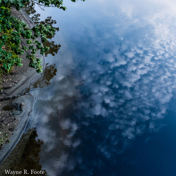 Sky reflection looking down from the New Hampshire end of the Stone Bridge.