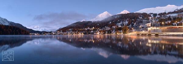 Panorama of Lej da San Murezzan and the city of St. Moritz with the characteristic peaks of, from the right, Piz Julier, Piz Albana and, on the far left, Piz da la Margna 