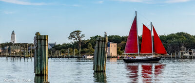 Shot from north side of harbor with Okracoke Lighthouse in the background.