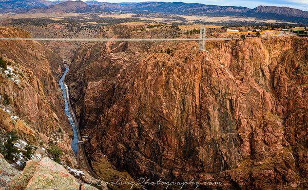 Here's the more famous shot of the bridge with the Arkansas River far below it.  This was taken inside the Royal gorge Park and after walking across the bridge, shooting westward.  You can either walk across the bridge or take the tram across the Gorge.  Sometimes, they allow cars to drive across the bridge.