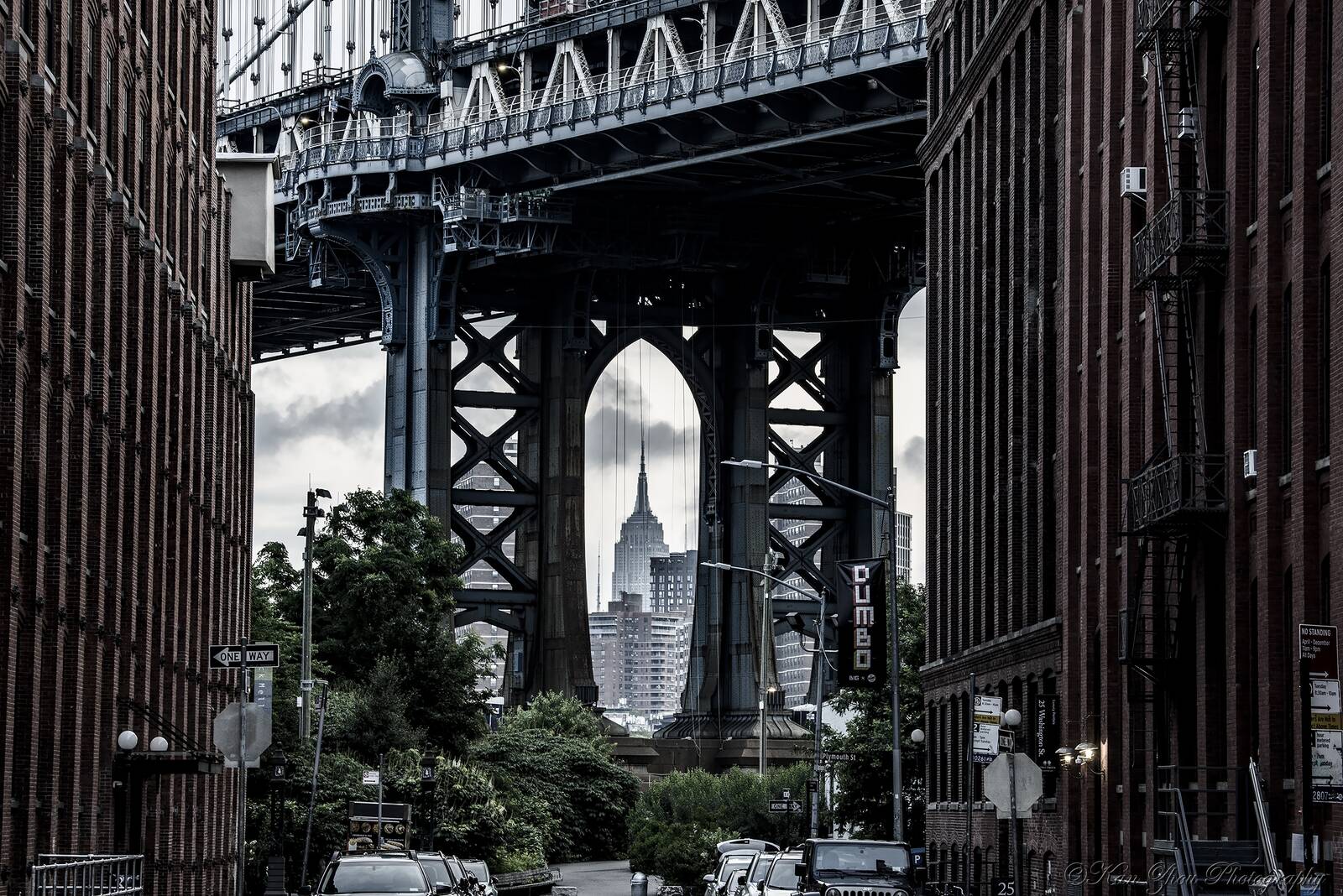 Image of Empire State Building view through the Manhattan Bridge by Kan Zhou