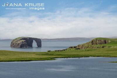 The sea arch Dore Holm, seen from Stenness.
