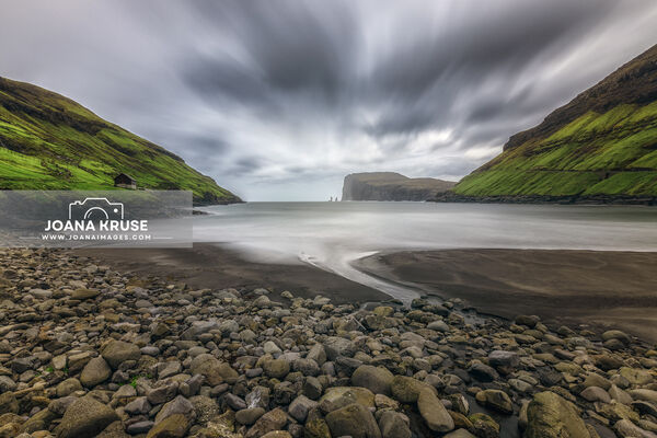 Tjornuvik and the Black Sand beach with view to the sea stacks Risin and Kellingin on Streymoy, Faroe Islands