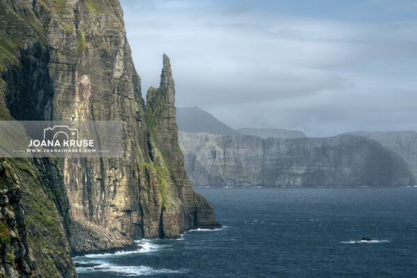 The sea stack Trollkunufingur near Sandavagur on the island of Vagar in the Faroe Islands