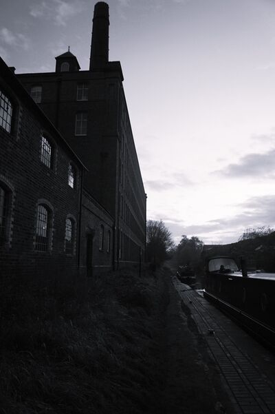 Angled, atmospheric image of Tolsons Mill, Fazeley, Tamworth.Taken from the canalsidee towpath at the rear of the property..